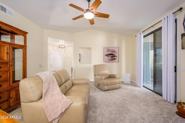 carpeted living room with lofted ceiling and ceiling fan