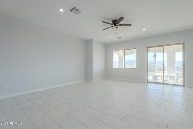 unfurnished room with ceiling fan