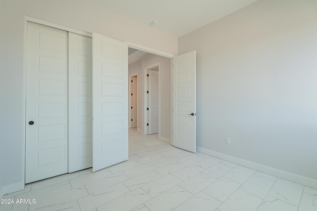 unfurnished bedroom with a closet