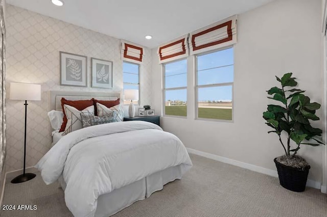carpeted bedroom with baseboards, wallpapered walls, and recessed lighting