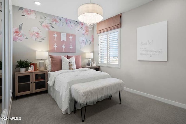 bedroom with baseboards, carpet flooring, and an inviting chandelier