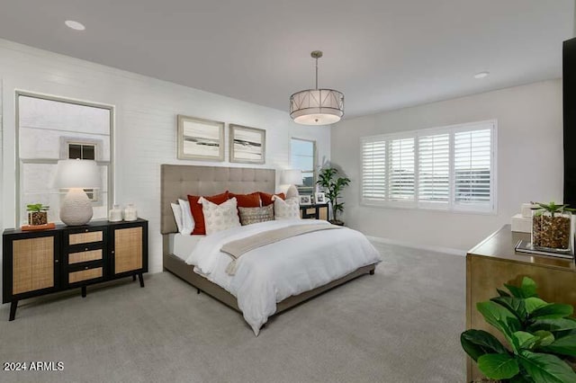 carpeted bedroom featuring baseboards
