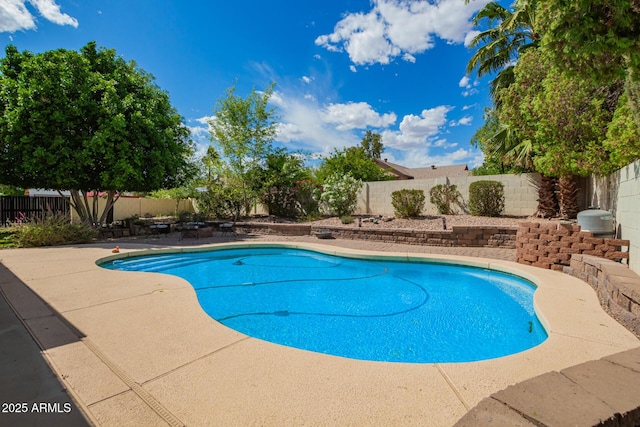 view of swimming pool with a fenced in pool, a fenced backyard, and a patio area