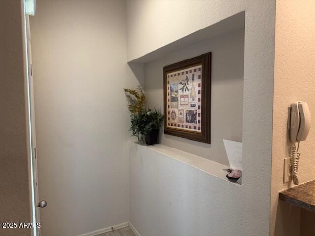 hallway featuring wood-type flooring