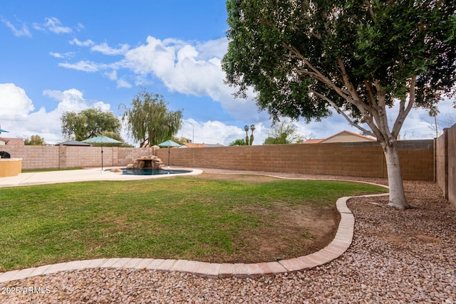 view of yard with a patio area, a fenced backyard, and a fenced in pool