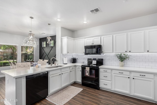 1324 S Banning St, Gilbert, AZ 85296 - kitchen with black appliances, a sink, a chandelier, decorative backsplash, and white cabinets