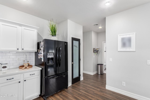 1324 S Banning St, Gilbert, AZ 85296 - kitchen with black refrigerator with ice dispenser, baseboards, tasteful backsplash, dark wood-style floors, and white cabinets