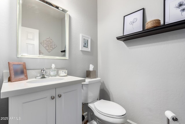 1324 S Banning St, Gilbert, AZ 85296 - bathroom featuring toilet, vanity, and a textured wall