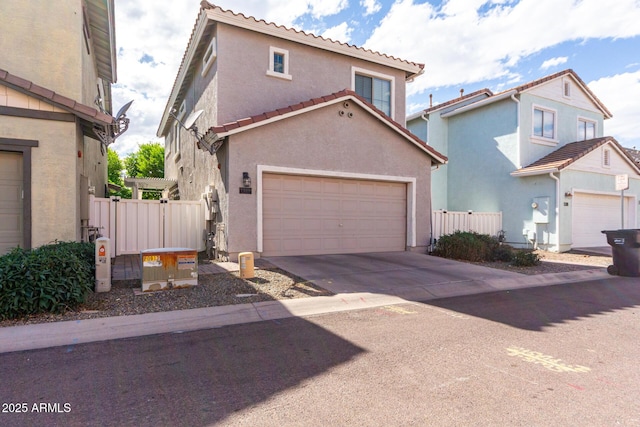 1324 S Banning St, Gilbert, AZ 85296 - view of front of house featuring stucco siding, driveway, and a tiled roof