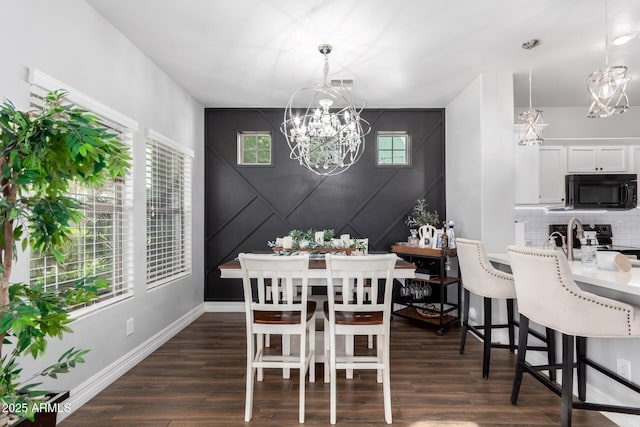 1324 S Banning St, Gilbert, AZ 85296 - dining area with a chandelier, plenty of natural light, and an accent wall