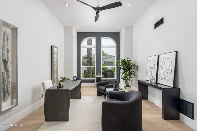 office area featuring light wood finished floors, visible vents, and recessed lighting