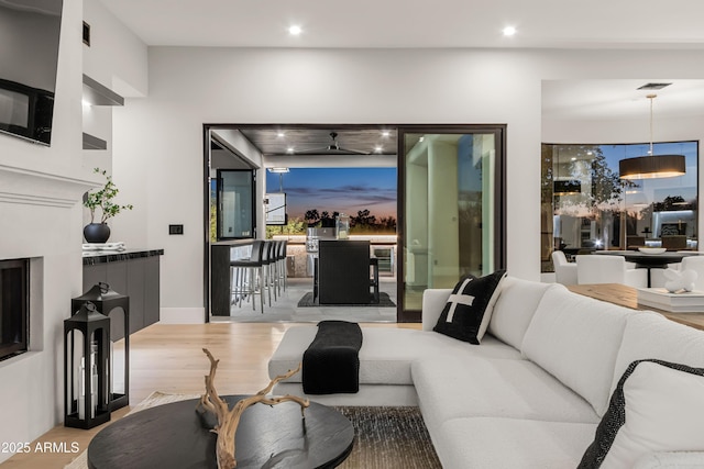 living area featuring recessed lighting and wood finished floors