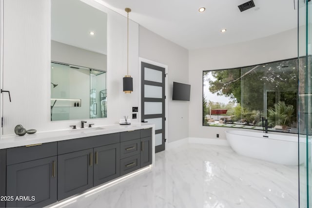 full bathroom featuring marble finish floor, recessed lighting, visible vents, vanity, and a freestanding tub