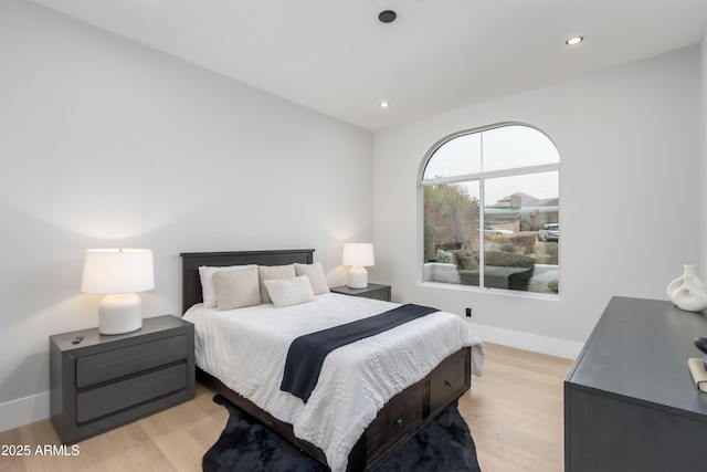 bedroom featuring light wood finished floors, baseboards, and recessed lighting