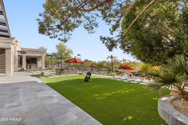 view of yard featuring a patio and fence