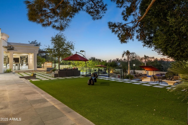 surrounding community with a patio area, outdoor lounge area, a lawn, and fence