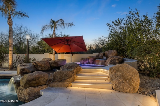 view of patio / terrace featuring fence