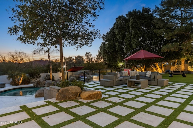 view of patio / terrace with a fenced backyard, an outdoor living space, and a fenced in pool