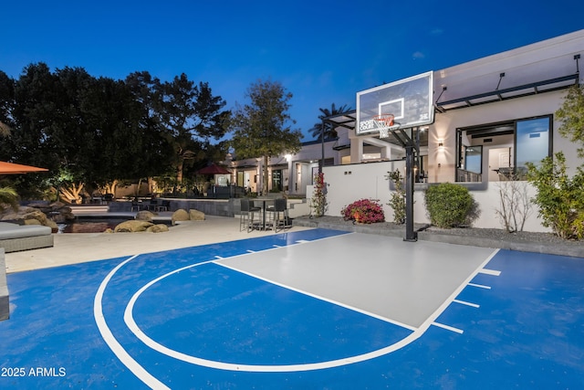 view of basketball court featuring community basketball court and fence