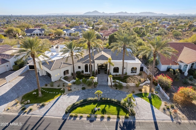 drone / aerial view featuring a residential view and a mountain view