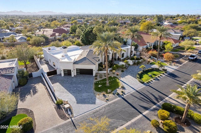 birds eye view of property with a residential view