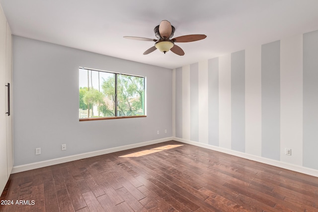 unfurnished room with ceiling fan and dark hardwood / wood-style floors