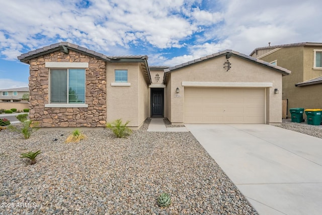 18766 W Montebello Ave, Litchfield Park, AZ 85340 - view of front of house with concrete driveway, stucco siding, stone siding, a tile roof, and a garage