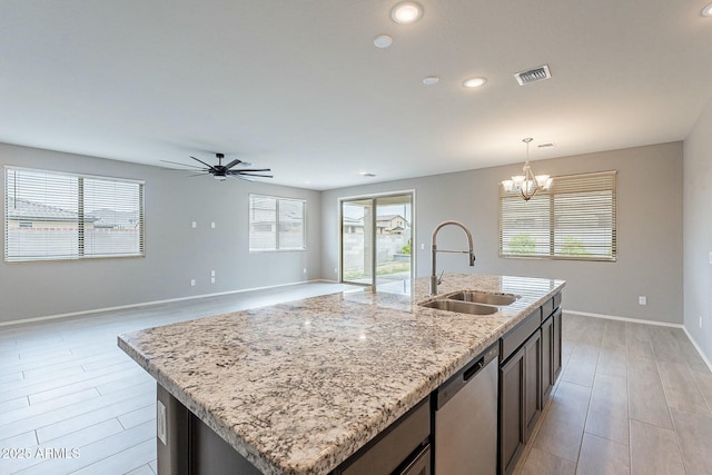 18766 W Montebello Ave, Litchfield Park, AZ 85340 - kitchen with visible vents, decorative light fixtures, a sink, ceiling fan with notable chandelier, and stainless steel dishwasher