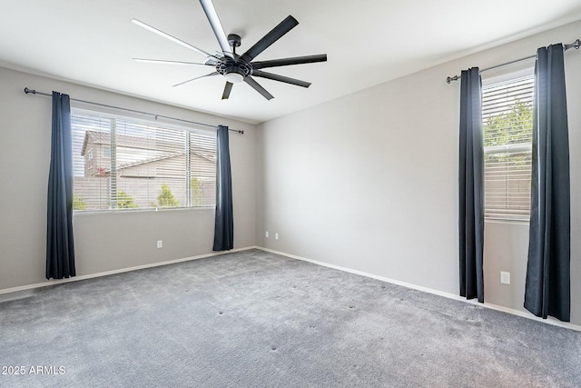 18766 W Montebello Ave, Litchfield Park, AZ 85340 - spare room featuring a healthy amount of sunlight, carpet flooring, ceiling fan, and baseboards