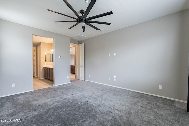 18766 W Montebello Ave, Litchfield Park, AZ 85340 - unfurnished bedroom featuring light colored carpet, baseboards, a ceiling fan, and ensuite bath