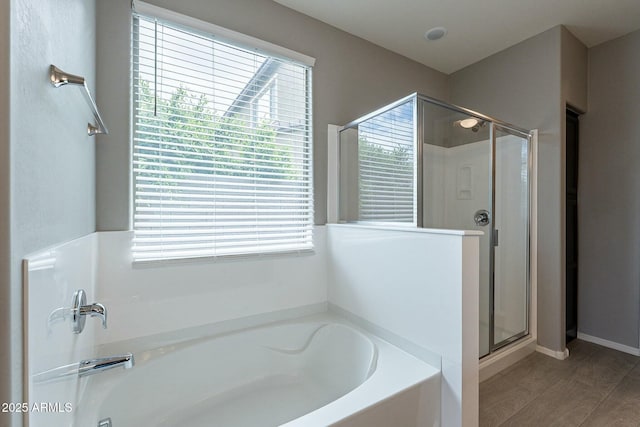 18766 W Montebello Ave, Litchfield Park, AZ 85340 - full bath featuring a shower stall, a bath, wood finished floors, and plenty of natural light