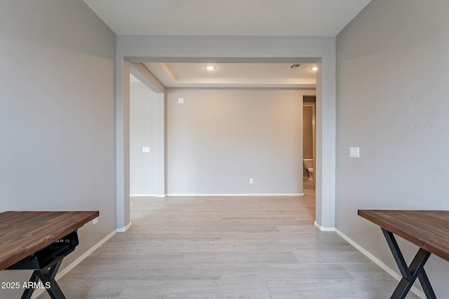18766 W Montebello Ave, Litchfield Park, AZ 85340 - corridor featuring visible vents, baseboards, and wood finished floors