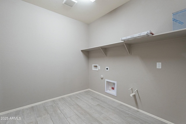 18766 W Montebello Ave, Litchfield Park, AZ 85340 - clothes washing area featuring light wood-style flooring, laundry area, hookup for an electric dryer, and gas dryer hookup