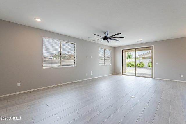 18766 W Montebello Ave, Litchfield Park, AZ 85340 - unfurnished room with light wood-type flooring, ceiling fan, and baseboards