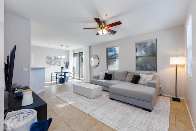 tiled living room with ceiling fan