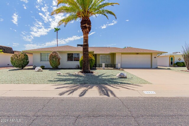 ranch-style house featuring a garage