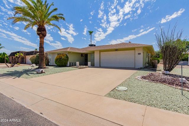 ranch-style house featuring a garage