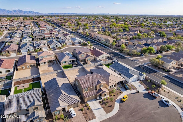 aerial overview of property's location with nearby suburban area and mountains