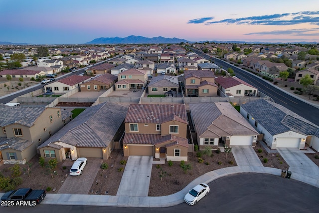 aerial view of residential area featuring a mountain backdrop