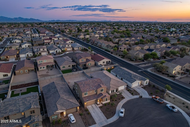 aerial view at dusk of a residential view and a mountain view
