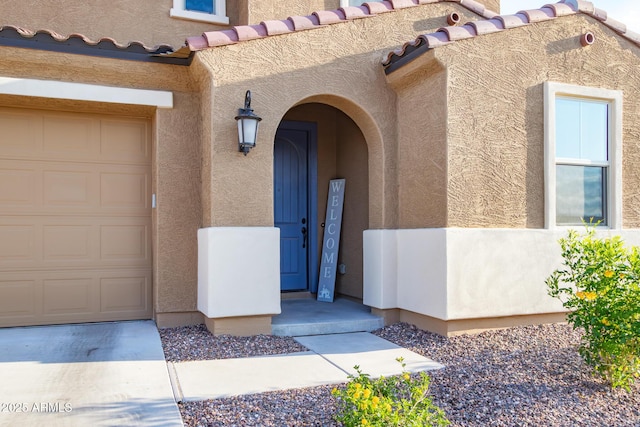 property entrance with stucco siding