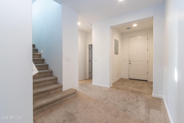 corridor with stairway, carpet, recessed lighting, and baseboards