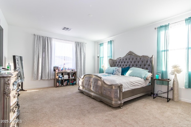 bedroom with carpet floors and baseboards