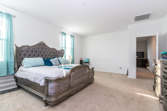 carpeted bedroom featuring baseboards