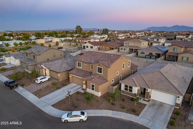 aerial view of residential area featuring a mountain backdrop