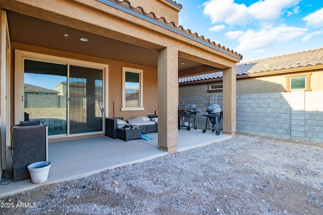 view of patio / terrace featuring an outdoor living space, fence, and area for grilling