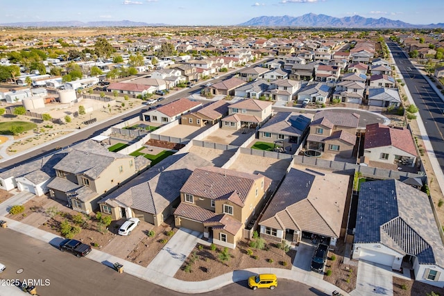aerial view of property's location featuring nearby suburban area and mountains