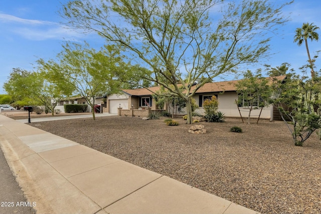 4840 E Sunnyside Dr, Scottsdale, AZ 85254 - ranch-style home with a garage, brick siding, and concrete driveway