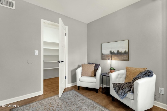4840 E Sunnyside Dr, Scottsdale, AZ 85254 - living area featuring baseboards, wood finished floors, and visible vents