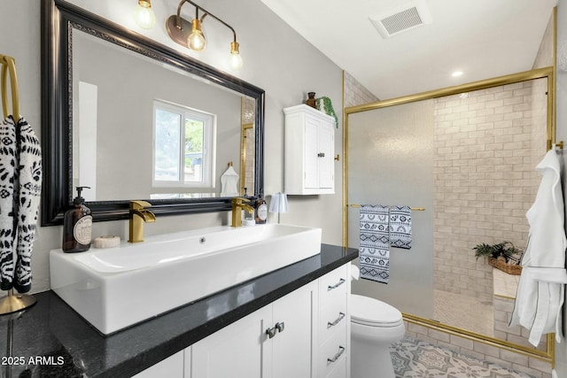 4840 E Sunnyside Dr, Scottsdale, AZ 85254 - full bath with tile patterned floors, toilet, a tile shower, visible vents, and vanity